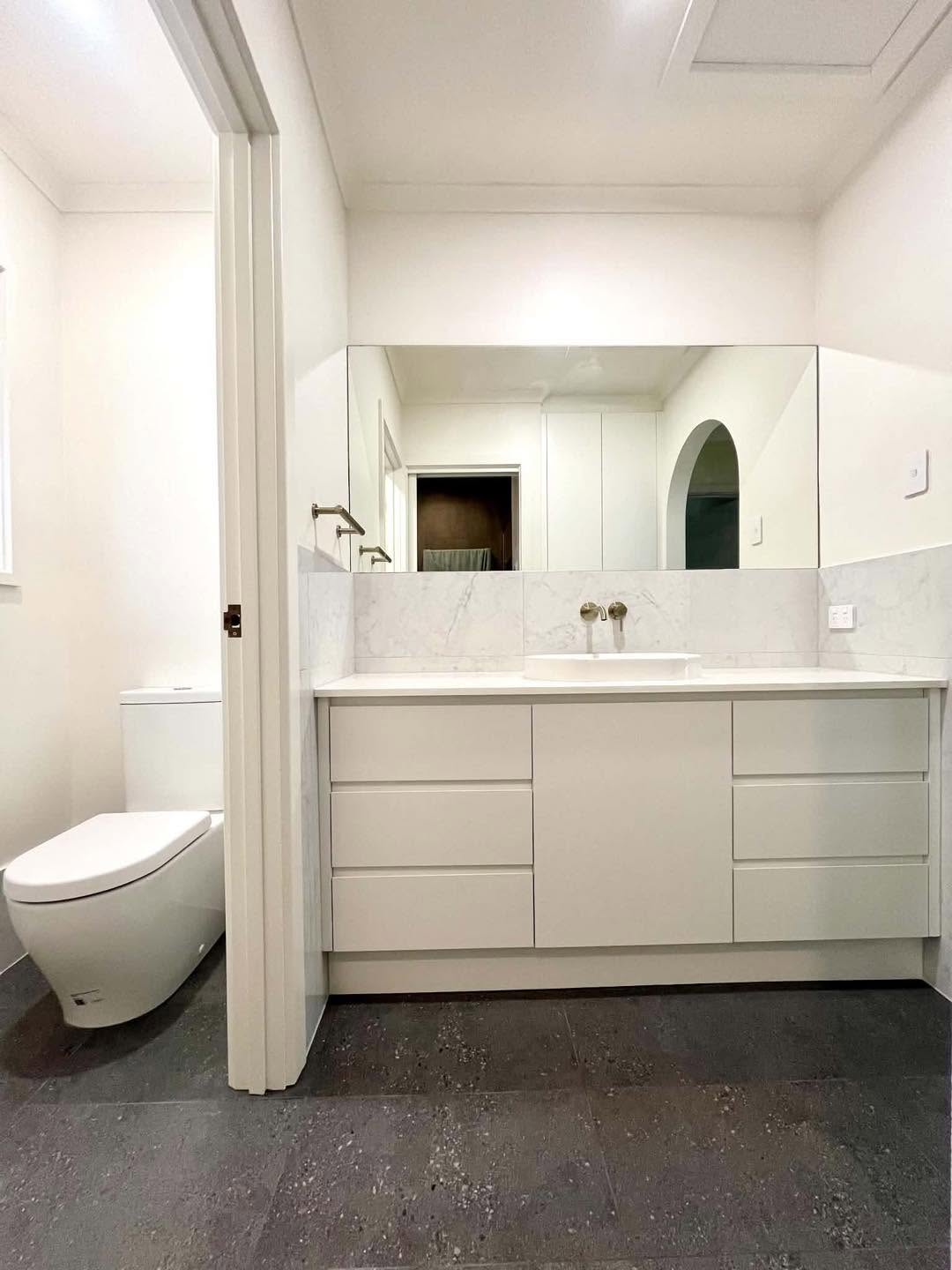 White Vanity & Charcoal Tiles